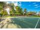 Well-lit outdoor basketball court nestled among trees at 1113 W Fir Tree Rd, Queen Creek, AZ 85140