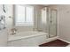 Relaxing bathroom with soaking tub and separate shower at 1113 W Fir Tree Rd, Queen Creek, AZ 85140