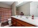 Bathroom with double vanity and striped shower curtain at 1113 W Fir Tree Rd, Queen Creek, AZ 85140