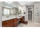 Double vanity bathroom with a large mirror and a walk-in closet at 1113 W Fir Tree Rd, Queen Creek, AZ 85140