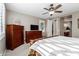 Spacious main bedroom with a dresser, TV, and ensuite bathroom access at 1113 W Fir Tree Rd, Queen Creek, AZ 85140