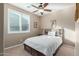 Bedroom with a ceiling fan and window shutters at 1113 W Fir Tree Rd, San Tan Valley, AZ 85140