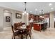 Charming breakfast nook with a round table and chairs, adjacent to the kitchen at 1113 W Fir Tree Rd, Queen Creek, AZ 85140