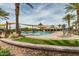 Resort-style pool with shade structures and lounge chairs at 1113 W Fir Tree Rd, Queen Creek, AZ 85140