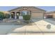 One-story house with a two-car garage and landscaped front yard at 1113 W Fir Tree Rd, Queen Creek, AZ 85140