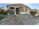 Charming curb appeal with a paved walkway and well-manicured landscaping at 1113 W Fir Tree Rd, Queen Creek, AZ 85140