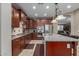 Modern kitchen with stainless steel appliances and granite countertops at 1113 W Fir Tree Rd, Queen Creek, AZ 85140