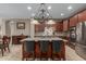 Gourmet kitchen with granite island and stainless steel appliances at 1113 W Fir Tree Rd, Queen Creek, AZ 85140