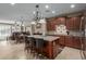 Spacious kitchen featuring granite countertops, an island, and ample cabinetry at 1113 W Fir Tree Rd, Queen Creek, AZ 85140