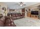 Open living room with a view into the kitchen and ample space for relaxing at 1113 W Fir Tree Rd, Queen Creek, AZ 85140