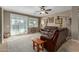 Relaxing living room with leather furniture and sliding doors leading to a patio at 1113 W Fir Tree Rd, Queen Creek, AZ 85140