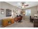 Home office with two desks, ample storage, and a large window at 1113 W Fir Tree Rd, Queen Creek, AZ 85140