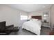 Cozy bedroom with a queen-size bed and stylish armchair at 11333 N 92Nd St # 2094, Scottsdale, AZ 85260