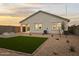 Backyard features turf, desert landscaping and an outdoor fire pit, perfect for relaxing at 1167 W Chimes Tower Dr, Casa Grande, AZ 85122