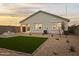 Backyard features turf, desert landscaping and an outdoor fire pit, perfect for relaxing at 1167 W Chimes Tower Dr, Casa Grande, AZ 85122