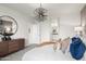 Spacious bedroom with modern decor, neutral color scheme, and ample natural light, and a ensuite bathroom at 1167 W Chimes Tower Dr, Casa Grande, AZ 85122