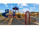 Colorful playground structure in a sandy play area at 1167 W Chimes Tower Dr, Casa Grande, AZ 85122