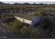 Aerial view of a single-story home with fenced yard in desert landscape at 12866 W Sun Ave, Eloy, AZ 85131