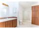 Bathroom with shower, vanity, and cabinets at 12866 W Sun Ave, Eloy, AZ 85131