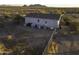 Mobile home with fenced backyard, dog houses, and mountain views at 12866 W Sun Ave, Eloy, AZ 85131