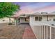 House backyard view with brick pathway and fence at 13438 W Prospect Dr, Sun City West, AZ 85375