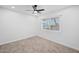 Bright bedroom with ceiling fan, neutral carpet and window coverings at 13438 W Prospect Dr, Sun City West, AZ 85375