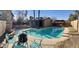 Inviting backyard oasis featuring a sparkling pool, fire pit, and patio seating at 1424 E Kerry Ln, Phoenix, AZ 85024