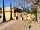Front view of a charming home with a gated entry and mature landscaping at 1424 E Kerry Ln, Phoenix, AZ 85024