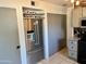 Modern kitchen showcasing a stainless steel refrigerator and ample storage at 1424 E Kerry Ln, Phoenix, AZ 85024