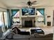 Bright living room featuring a fireplace, comfy seating, and a large TV at 1424 E Kerry Ln, Phoenix, AZ 85024