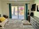Main bedroom featuring a slider to patio, television, and dresser at 1424 E Kerry Ln, Phoenix, AZ 85024