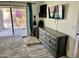 Main bedroom featuring a slider to patio, television, and gray dresser at 1424 E Kerry Ln, Phoenix, AZ 85024