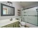 Updated bathroom with a sliding glass shower door at 14416 W Kiowa Trl, Surprise, AZ 85374