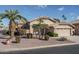 Single story home with two car garage and desert landscaping at 14416 W Kiowa Trl, Surprise, AZ 85374