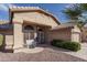 Inviting home exterior featuring a landscaped front yard and charming entryway at 14416 W Kiowa Trl, Surprise, AZ 85374