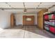 Garage with built-in cabinets and shelving for storage at 14416 W Kiowa Trl, Surprise, AZ 85374