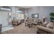 Cozy living room with ample natural light and comfortable seating at 14416 W Kiowa Trl, Surprise, AZ 85374