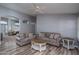 Spacious living room with hardwood floors and neutral color palette at 14416 W Kiowa Trl, Surprise, AZ 85374