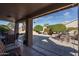 Covered patio with seating area and view of backyard at 14416 W Kiowa Trl, Surprise, AZ 85374