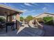 Patio with built-in BBQ and seating area at 14416 W Kiowa Trl, Surprise, AZ 85374