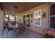 Covered patio with seating area and access to home at 14416 W Kiowa Trl, Surprise, AZ 85374