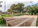 Community shuffleboard court with covered seating area at 14416 W Kiowa Trl, Surprise, AZ 85374