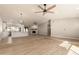 Open concept living space with kitchen island and vaulted ceiling at 1510 E Ivyglen St, Mesa, AZ 85203