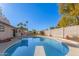 Refreshing kidney-shaped pool, complete with diving board at 1510 E Ivyglen St, Mesa, AZ 85203