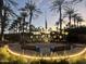 Veterans memorial with benches and palm trees at dusk at 16828 W Palisade Trail Ln, Surprise, AZ 85387