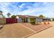 House exterior with red gate and nicely landscaped yard at 1716 N Longmore St, Chandler, AZ 85224