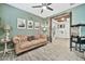 Relaxing living area featuring a leather sofa and rustic decor at 17255 W Seldon Ln, Waddell, AZ 85355