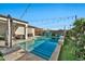 Relaxing pool area with patio furniture and string lights at 17255 W Seldon Ln, Waddell, AZ 85355