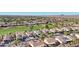 Aerial view showing houses near golf course with mountain views at 22728 N Arrellaga Dr, Sun City West, AZ 85375