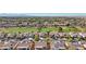 Aerial view of community, including golf course, homes, and surrounding desert landscape at 22728 N Arrellaga Dr, Sun City West, AZ 85375